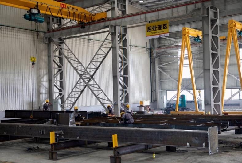 Steel frame erected inside the workshop during trial assembly