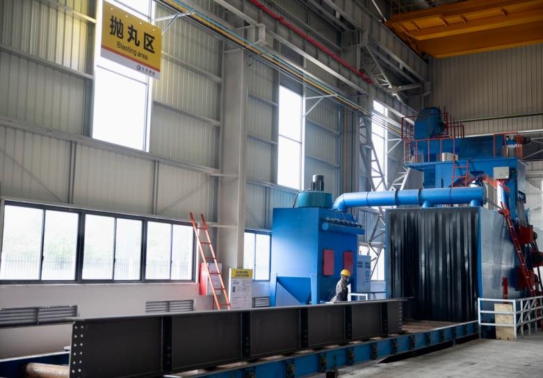 Shot blasting area with the blasting machine and extraction ducting